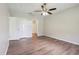 Bright and open bedroom features a ceiling fan, closet and ensuite bathroom at 702 Pasteur Ln, Kissimmee, FL 34759