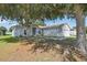 View of the charming single-story home with a well-maintained lawn at 702 Pasteur Ln, Kissimmee, FL 34759