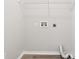 Empty Laundry Room featuring tile flooring, utility hook-ups, and overhead shelving at 702 Pasteur Ln, Kissimmee, FL 34759
