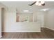 Living room featuring modern wood-look floors and an open view to the kitchen at 702 Pasteur Ln, Kissimmee, FL 34759