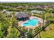 Aerial view of the pool, tennis courts, and clubhouse in the community at 813 Marsh Reed Dr, Winter Garden, FL 34787