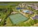 Aerial view of community amenities including pool, tennis courts, and playground at 813 Marsh Reed Dr, Winter Garden, FL 34787