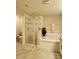 Bathroom featuring glass enclosed shower, soaking tub, and neutral-tone tile floor at 813 Marsh Reed Dr, Winter Garden, FL 34787