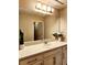 Bathroom vanity area featuring a large mirror, a sink, and white countertop at 813 Marsh Reed Dr, Winter Garden, FL 34787