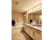 Well-lit bathroom featuring a soaking tub, granite counters, and a double vanity at 813 Marsh Reed Dr, Winter Garden, FL 34787