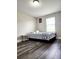 Bedroom features wood laminate flooring, neutral paint and a queen size bed at 813 Marsh Reed Dr, Winter Garden, FL 34787