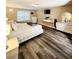 Spacious bedroom with wood-look flooring and bright, natural light at 813 Marsh Reed Dr, Winter Garden, FL 34787
