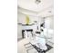 Bright dining room featuring a glass table, modern white chairs, and decorative accents at 813 Marsh Reed Dr, Winter Garden, FL 34787