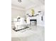Bright dining room with glass table, modern chairs, stylish decor, and sleek tile flooring at 813 Marsh Reed Dr, Winter Garden, FL 34787