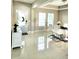 Bright dining area with tile flooring, featuring modern furniture and decor near the entrance at 813 Marsh Reed Dr, Winter Garden, FL 34787
