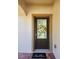 Inviting front entrance with a decorative wreath and 'hello' door mat on the brick porch at 813 Marsh Reed Dr, Winter Garden, FL 34787