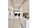 Entryway featuring tile flooring, white console table, and decorative accents leading to living spaces at 813 Marsh Reed Dr, Winter Garden, FL 34787
