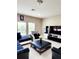 Comfortable living room featuring tile flooring and natural light at 813 Marsh Reed Dr, Winter Garden, FL 34787