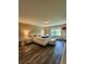 A primary bedroom with wood floors, luxury bed and furniture, and a view to the exterior at 813 Marsh Reed Dr, Winter Garden, FL 34787