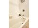 Close-up of bathtub and shower featuring white tiling and chrome fixtures at 813 Marsh Reed Dr, Winter Garden, FL 34787
