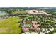 Resort-style community showcasing pool, clubhouse, and verdant landscaping nestled amid lush greenery at 911 Tidal Pond Dr, Groveland, FL 34736