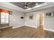 Bright bedroom with trey ceilings, crown molding, neutral paint, and plantation shutters at 911 Tidal Pond Dr, Groveland, FL 34736