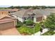 Charming single-story home featuring well-kept landscaping, a two car garage, and neutral color palette at 911 Tidal Pond Dr, Groveland, FL 34736