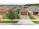 This single Gathering home has a brick paved driveway and a two car garage at 911 Tidal Pond Dr, Groveland, FL 34736
