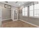 Comfortable home office with built-in desk, modern lighting, and plantation shutters at 911 Tidal Pond Dr, Groveland, FL 34736