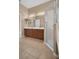 Bright bathroom featuring a double vanity and glass shower at 9650 Bay Pine Ln, Orlando, FL 32832