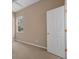 Neutral bedroom featuring a window and door at 9650 Bay Pine Ln, Orlando, FL 32832