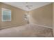 Calm, neutral-toned carpeted bedroom with natural light from windows at 9650 Bay Pine Ln, Orlando, FL 32832