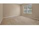 Neutral bedroom with carpeted floor and large window allowing for natural light at 9650 Bay Pine Ln, Orlando, FL 32832