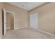 Neutral bedroom featuring a double door closet at 9650 Bay Pine Ln, Orlando, FL 32832