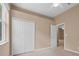 Neutral bedroom featuring a double door closet at 9650 Bay Pine Ln, Orlando, FL 32832
