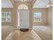 Bright entryway featuring tile floors, high ceilings and a decorative front door at 9650 Bay Pine Ln, Orlando, FL 32832