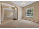 Cozy living room features carpet, front door and an abundance of natural light at 9650 Bay Pine Ln, Orlando, FL 32832
