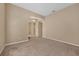 Open-concept living room featuring carpeted floors and neutral-colored walls at 9650 Bay Pine Ln, Orlando, FL 32832
