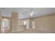 Inviting living room with open layout, neutral carpet, and lots of natural light at 9650 Bay Pine Ln, Orlando, FL 32832
