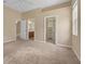 Carpeted main bedroom with walk-in closet, ensuite bathroom access, and natural light at 9650 Bay Pine Ln, Orlando, FL 32832