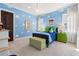 Bright 'Toy Story' themed bedroom with cloud accents, playful decor, and ample natural light at 10143 Mattraw Pl, Golden Oak, FL 32836