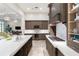 Well-equipped kitchen with modern appliances, ample counter space, and convenient open layout at 10143 Mattraw Pl, Golden Oak, FL 32836