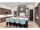 Spacious kitchen features large island with seating and custom cabinetry, perfect for entertaining at 10143 Mattraw Pl, Golden Oak, FL 32836