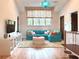 Bright living room featuring a comfortable couch, entertainment center and hardwood floors at 10143 Mattraw Pl, Golden Oak, FL 32836