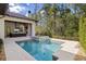 Gorgeous pool and jacuzzi with an outdoor living space that features a tv and grill at 10143 Mattraw Pl, Golden Oak, FL 32836