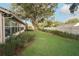 This home offers a beautiful backyard with an expansive lawn and mature trees at 1073 Sadie Ln, Winter Garden, FL 34787