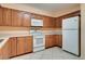 Fully-equipped kitchen with white appliances, laminate countertops, and ample cabinet space at 1073 Sadie Ln, Winter Garden, FL 34787