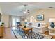 Bright living room featuring hardwood floors, vaulted ceilings, and modern furnishings at 1073 Sadie Ln, Winter Garden, FL 34787