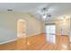 Open-concept living room with vaulted ceilings, hardwood flooring, and large windows at 1073 Sadie Ln, Winter Garden, FL 34787