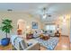 Inviting living room with wood floors, vaulted ceilings, and modern decor at 1073 Sadie Ln, Winter Garden, FL 34787