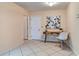 This home offers an open office space complete with a desk, art, and tile flooring at 1073 Sadie Ln, Winter Garden, FL 34787