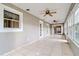 This sun room has lots of light and ceiling fans for comfort at 1073 Sadie Ln, Winter Garden, FL 34787