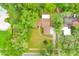 Gorgeous aerial view of the home showcasing the landscaping, driveway and proximity to other properties at 1102 Winter Springs Blvd, Winter Springs, FL 32708