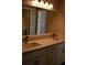 Modern bathroom featuring double sinks, quartz counters and white cabinetry at 1102 Winter Springs Blvd, Winter Springs, FL 32708
