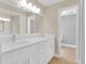 Bathroom with double sink vanity and adjacent water closet/shower at 1102 Winter Springs Blvd, Winter Springs, FL 32708